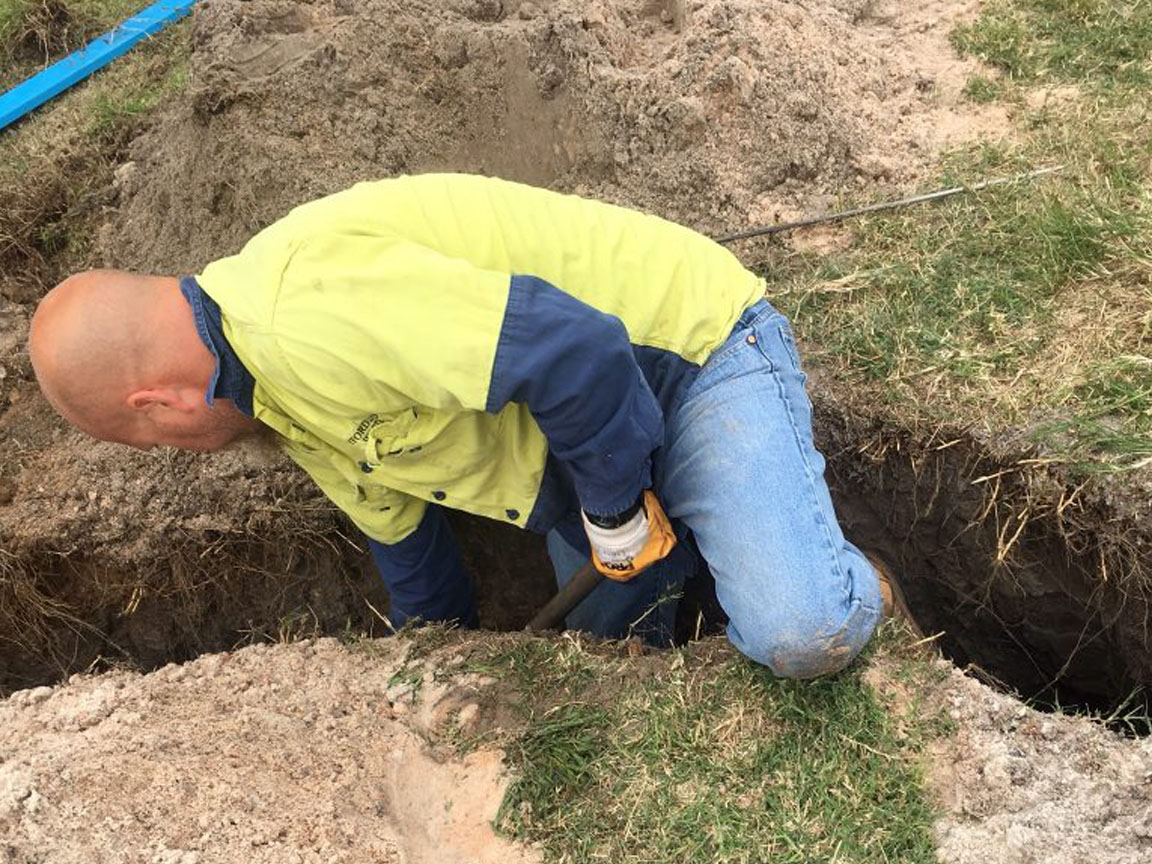 Dean inspecting septic system work in Byford